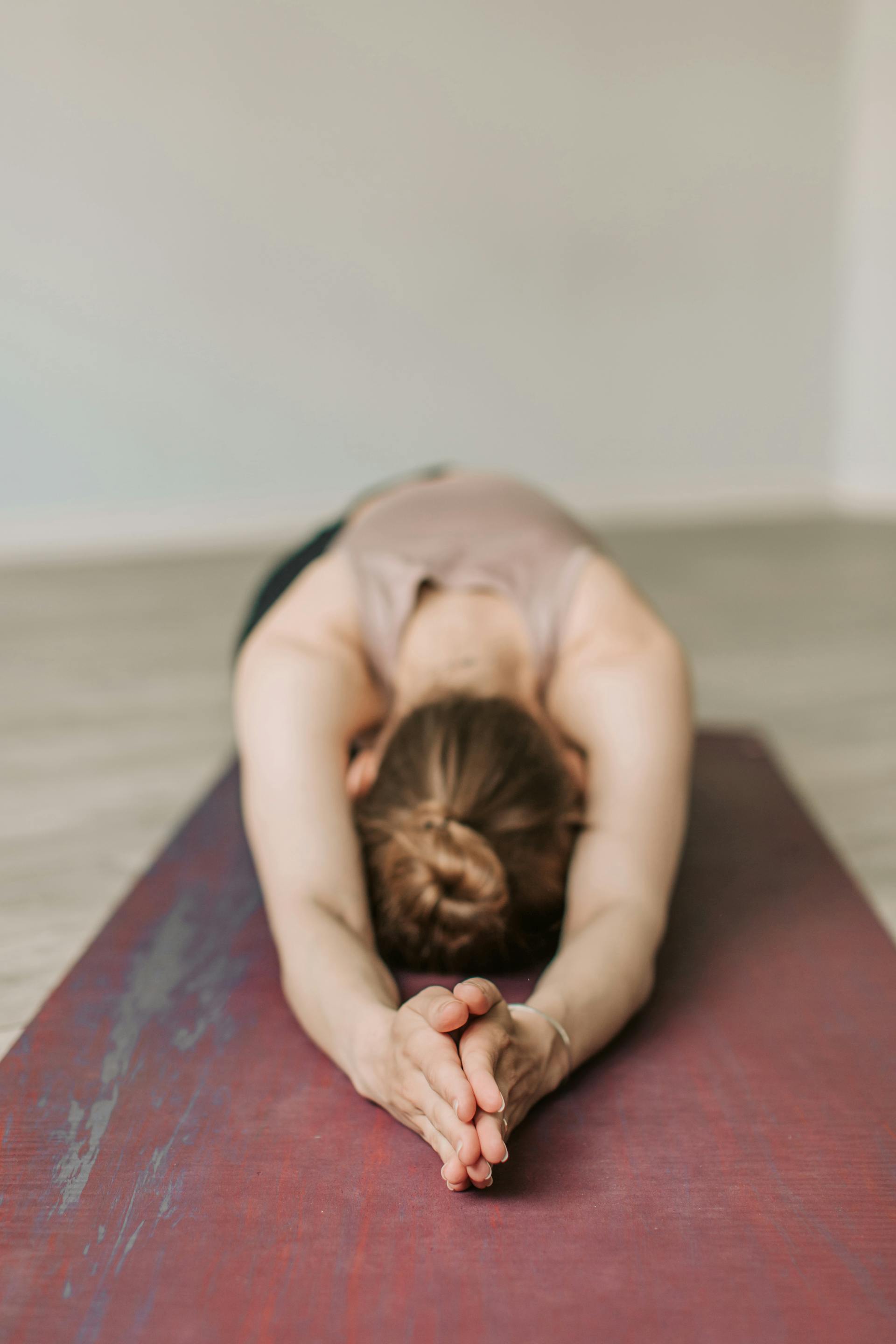 A guest folded into child's pose — Vinyasa & Yin private session